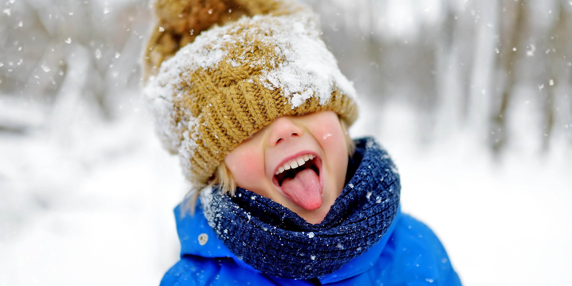 A child delighting in the snow | Source: Shutterstock