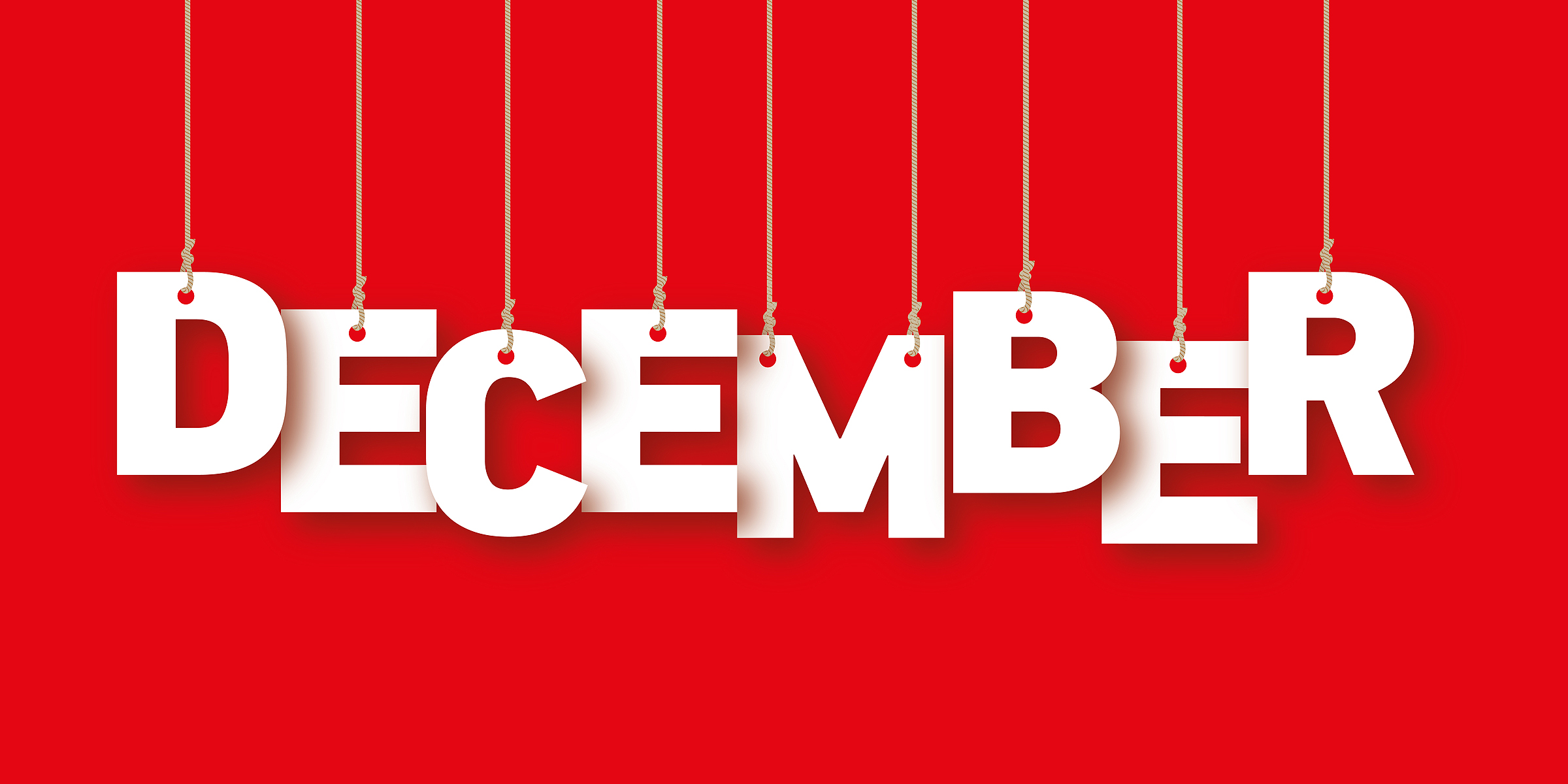 The word December on a red background | Source: Shutterstock