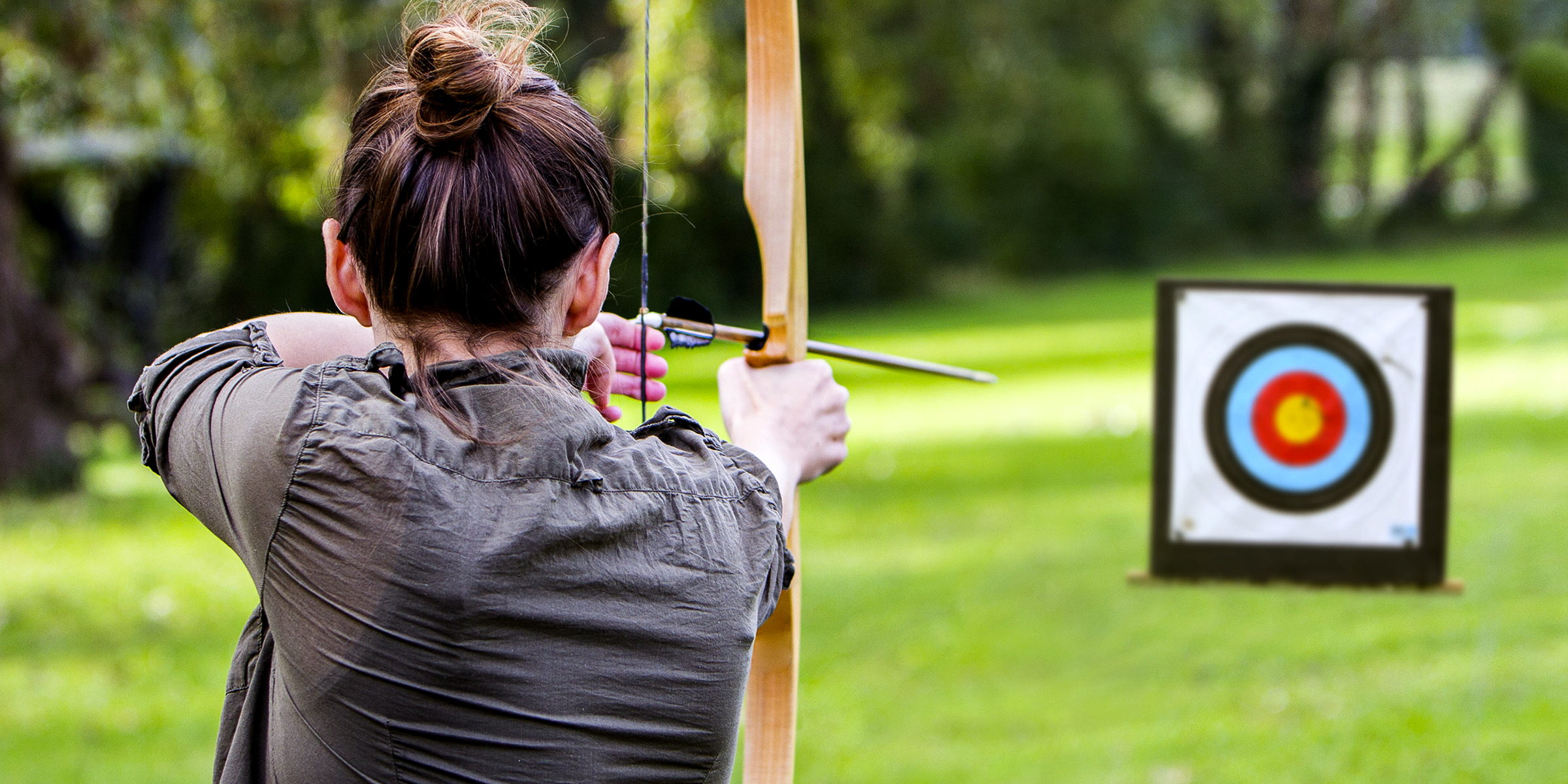 A woman engaged in archery | Source: Shutterstock