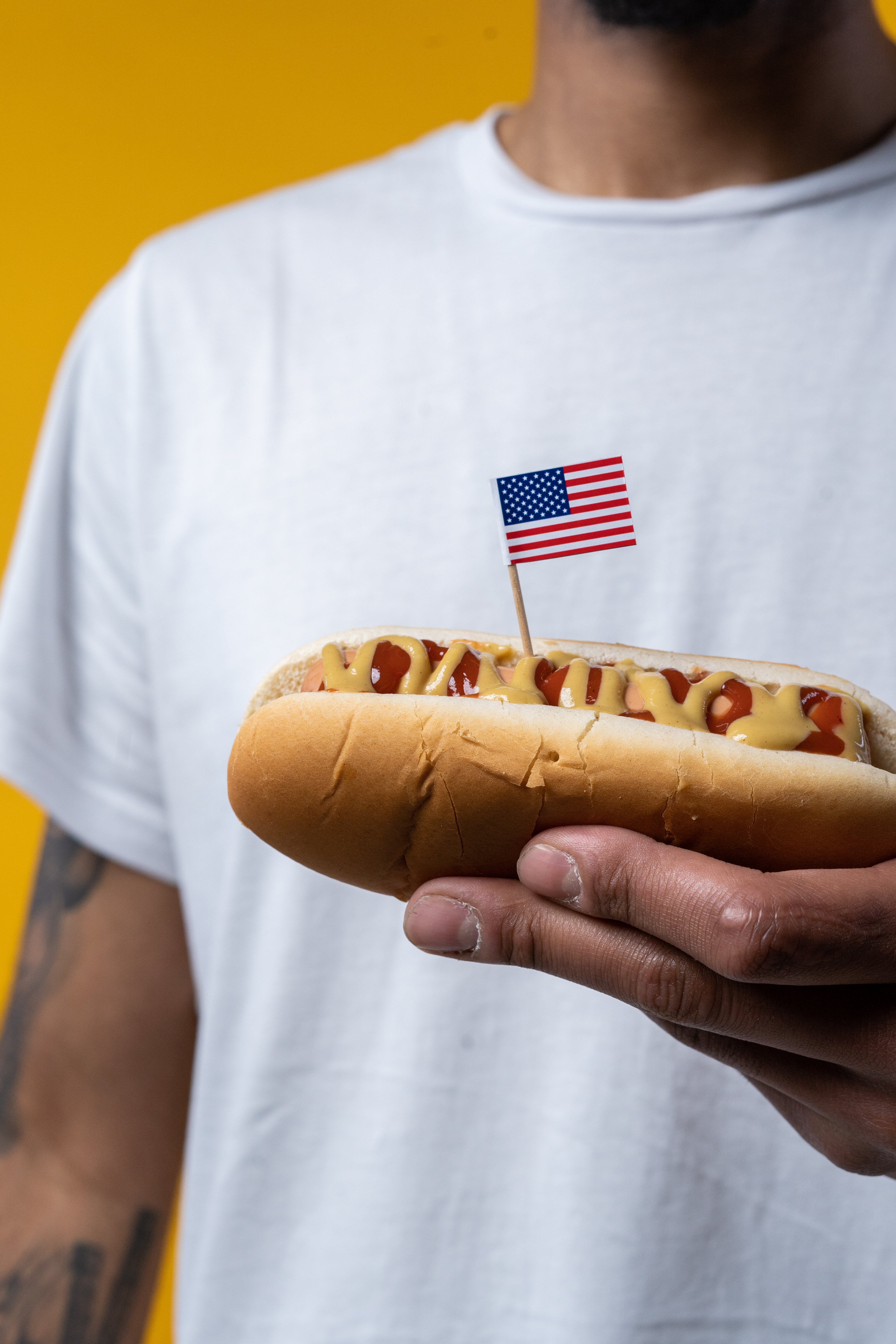 A man holding a hotdog | Source: Pexels